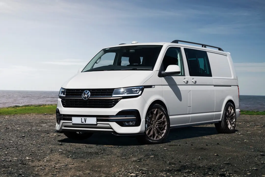 White VW Transporter LV-S parked on the coast
